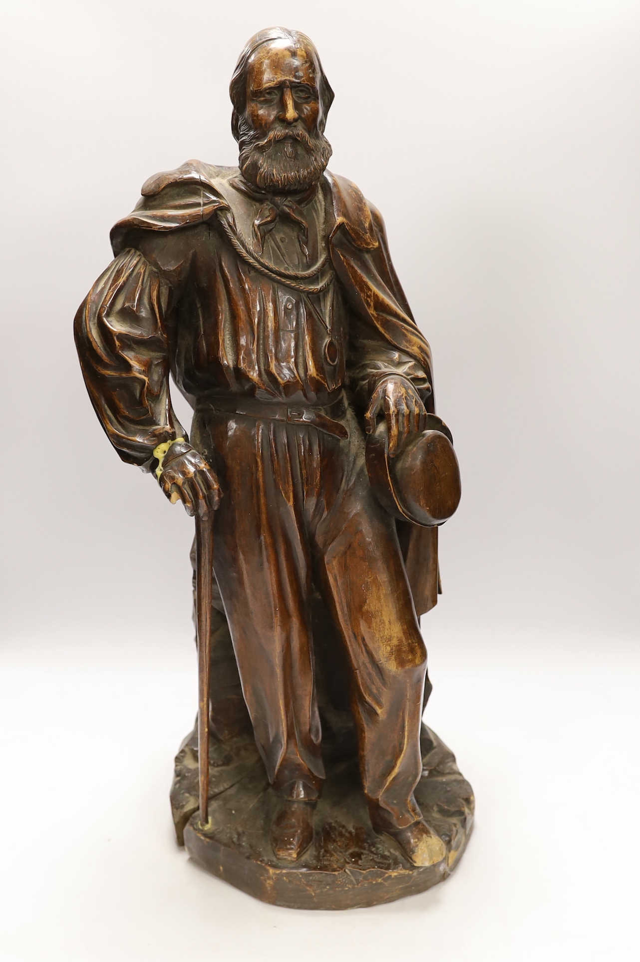 A carved wood figure of Garibaldi, signed to G. Robinson, Manchester, 61cm